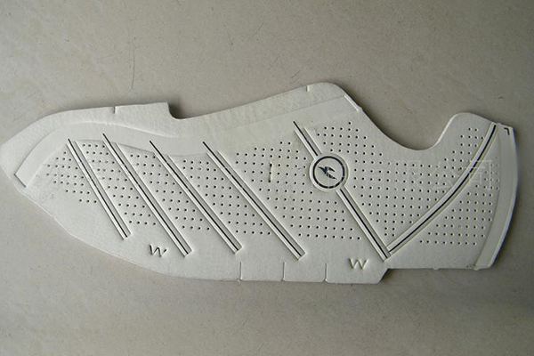 Laser pierced surface of shoe